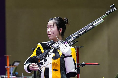 Yang Qian, of China, reacts after winning the gold medal in the women's 10-meter air rifle at the Asaka Shooting Range in the 2020 Summer Olympics, July 24, 2021, in Tokyo, Japan. (Photo | AP)