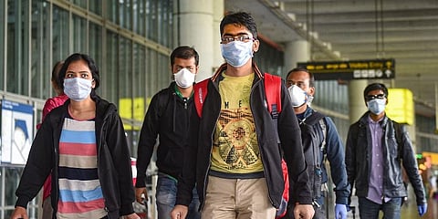 Passengers wear masks in the wake of coronavirus pandemic at the Kolkata airport. (File photo| PTI)