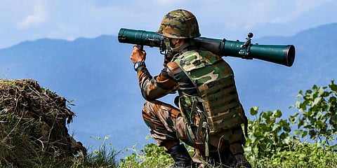 An RPG-armed Indian soldier patrols along the Line of Control (LOC) between India and Pakistan border in Poonch district. (Photo | PTI)