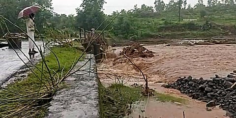 A road damaged due to heavy rainfall causes a flood in Raigad. (Photo | ANI)