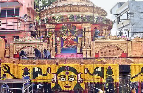 Workers deck up the historic Sri Ujjaini Mahankali Temple in Secunderabad ahead of the Lashkar Bonalu festival, on Saturday