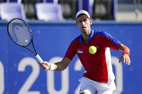 Novak Djokovic, of Serbia, returns to Hugo Dellien, of Bolivia, during the tennis competition at the 2020 Summer Olympics. (Photo | AP)