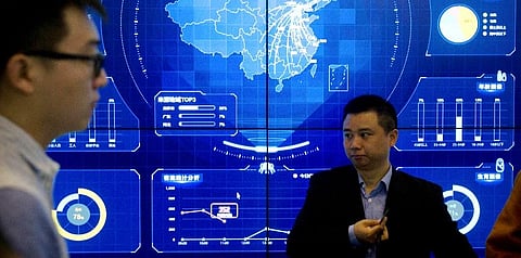 In this April 26, 2018, file photo, visitors stand in front of an electronic data display showing a map of China at the Global Mobile Internet conference in Beijing. (File photo | AP)
