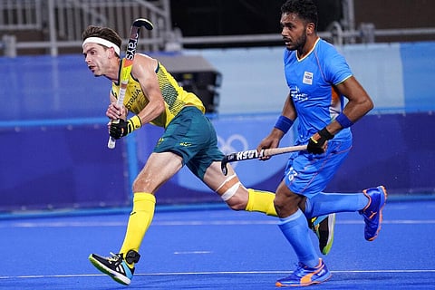 Australia's Flynn Andrew Ogilvie (22) watches his goal on India goalkeeper Sreejesh Parattu Raveendran as Harmanpreet Singh (13) looks on. (Photo | AP)