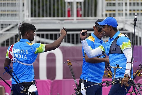 From left, India's Pravin Jadhav, Tarundeep Rai, and Atanu Das celebrate after winning against Kazakhstan. (Photo | AP)