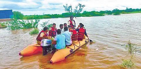 Rescue personnel shift residents of Jambagi KD village in Bagalkot district to relief centres, after their houses were submerged in floodwaters | Express