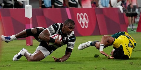 Fiji's Josua Vakurunabili, left, takes a tumble with Australia's Dietrich Peter Roache, in their men's rugby sevens quarterfinal match at the 2020 Summer Olympics in Tokyo, Japan. (Photo | AP)