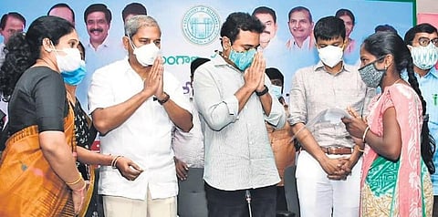 MAUD Minister KT Rama Rao greets one of the beneficiaries in Sircilla, on Monday. (Photo | Express)