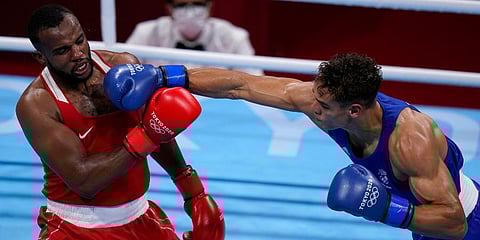 New Zealand's David Nyika (R) lands a punch to Youness Baalla, of Morocco, during their heavy weight (91kg) preliminary boxing match at the 2020 Summer Olympics in Tokyo, Japan. (Photo | AP)