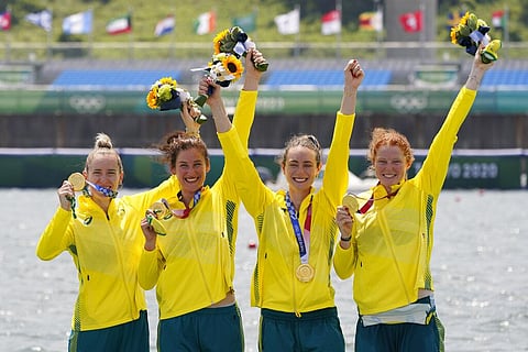 Lucy Stephan, Rosemary Popa, Jessica Morrison and Annabelle McIntyre, of Australia, celebrate with the gold medal following the women's rowing four final. (Photo | AP)