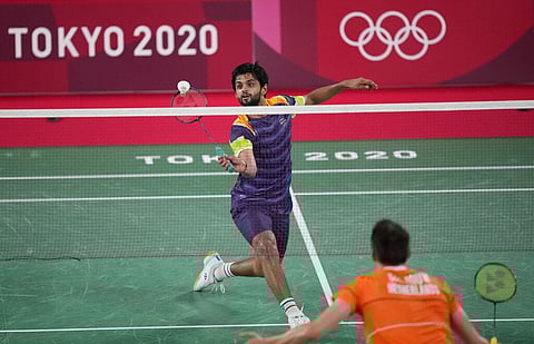 Sai Praneeth of India competes against Netherland's Mark Caljown during men's singles group play stage Badminton match at the 2020 Summer Olympics. (Photo | AP)