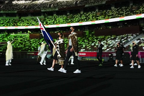 Sarah Hirini and David Nyika, of New Zealand, carry their country's flag during the opening ceremony in the Olympic Stadium at the 2020 Summer Olympics. (Photo | AP)
