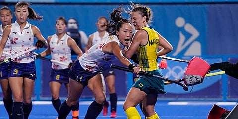 Japan's Shihori Oikawa (11) drives into Australia's Ambrosia Malone (2) during a women's field hockey match at the 2020 Summer Olympics in Tokyo, Japan. (Photo | AP)