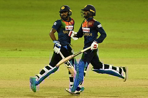 Sri Lanka's Wanindu Hasaranga (L) and Dhananjaya de Silva run between the wickets during 3rd T20 match against India at R.Premadasa Stadium in Colombo on July 29, 2021. (Photo | AFP)