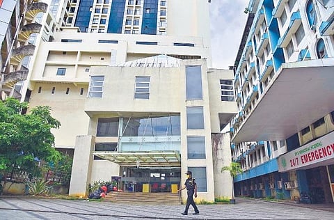 A security guard at the PVS Hospital on Wednesday. The hospital, which was functioning as a Covid care centre, has wound up its operations | Albin Mathew