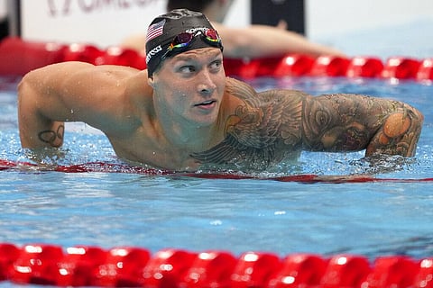 Caeleb Dressel of the United States leaves the pool after winning the men's 100-meter freestyle final at the 2020 Summer Olympics. (Photo | AP)