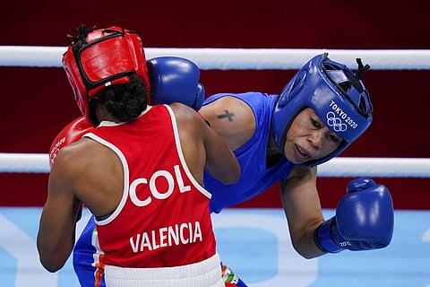 Columbia's Ingrit Lorena Valencia Victoria, left, exchanges punches with India's Chungneijang Mery Kom Hmangte. (Photo | AP)