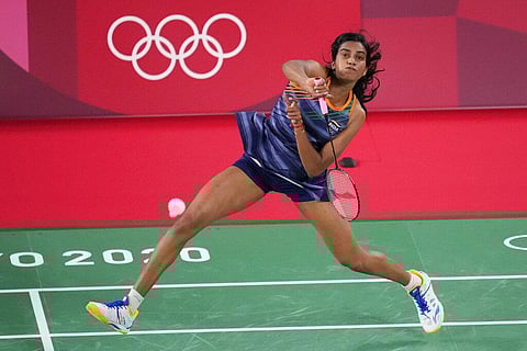 Pusarla V. Sindhu of India plays against Denmark's Mia Blichfeldt during their women's round of 16 badminton matchat the 2020 Summer Olympics. (Photo | AP)