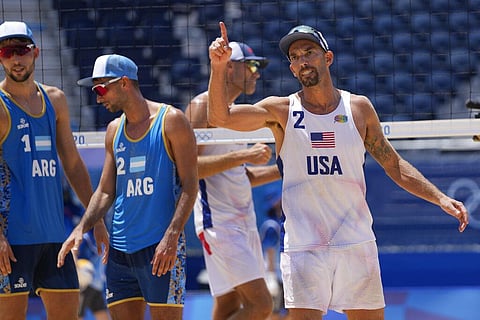 Nicholas Lucena, right, of the United States, celebrates winning a men's beach volleyball match. (Photo | AP)