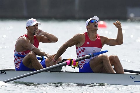 Martin Sinkovic and Valent Sinkovic of Croatia celebrate after winning the gold medal in the men's rowing pair final at the 2020 Summer Olympics. (Photo | AP)