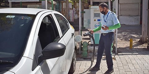 A driver of an electric car charges his vehicle at public charging station in New Delhi, India, Thursday, April 1, 2021. (Photo | AP)