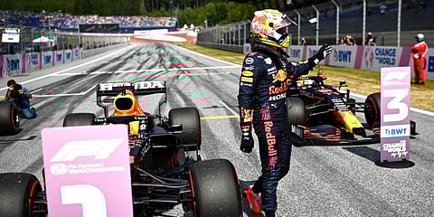 Red Bull's Max Verstappen of the Netherlands waves in the winners circle after he placed first to take pole position during the qualifying session ahead of the Austrian Formula One Grand Prix | AP