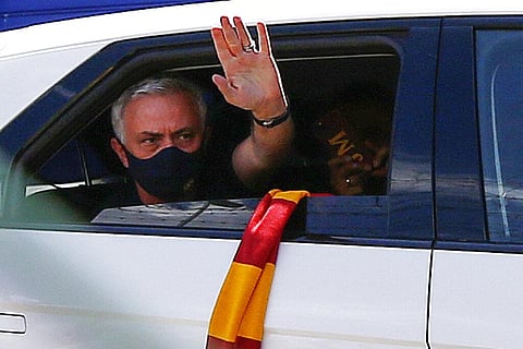 AS Roma new head coach Jose Mourinho salutes fans waiting outside Rome's Ciampino airport upon his arrival in Rome Friday, July 2, 2021. (Photo | AP)