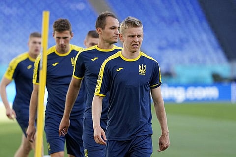 Ukraine's Oleksandr Zinchenko, right, looks on during a training session at the Olympic stadium in Rome. (Photo | AP)