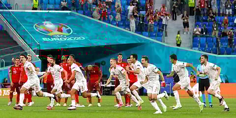Spanish players celebrate after winning the Euro 2020 quarterfinal match against Switzerland. (Photo | AP)