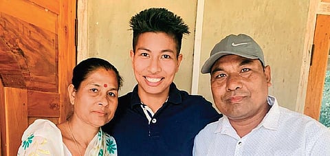 Boxer Lovlina Borgohain (centre) with her parents. (Photo | Special Arrangement)