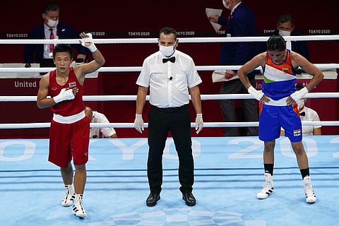 Sudaporn Seedondee, of Thailand, left, reacts after defeating India's Simranjit Kaur Baatth, right, in their women's light weight 60kg preliminary boxing match. (Photo | AP)