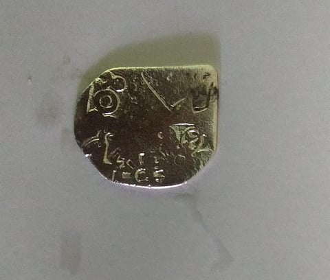 A silver punch-marked coin was discovered at Keezhadi . (Photo | Express)