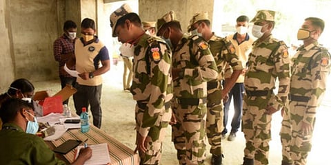 Health workers collect covid test sample to the police officers who will be on duty during the President Visit for the commemoration of the 100th year of the Madras Legislative Council. (Photo | EPS)