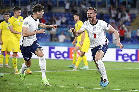 England's Jordan Henderson celebrates with John Stones, left, after scoring during the Euro 2020 quarterfinal match against Ukraine at Olympic stadium, Rome, July 3, 2021. (Photo | AP)