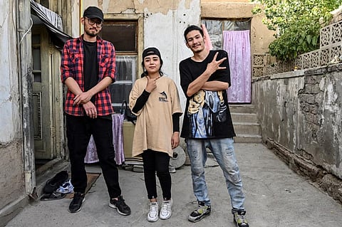 In this photo taken on June 12, 2021, Manizha Talash (C), the only female member of a group of breakdancers comprised of mostly Hazara boys, poses with two members of her troupe in Kabul (Photo | AFP)