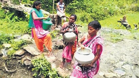 Womenfolk of Khadia households fetching water from a stream (Photo | Express)