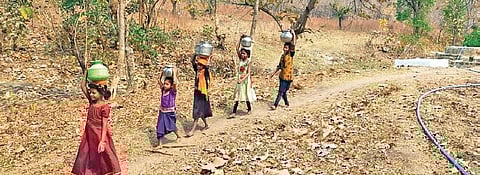 Children belonging to Kolam tribe travel long distances to fetch drinking water.