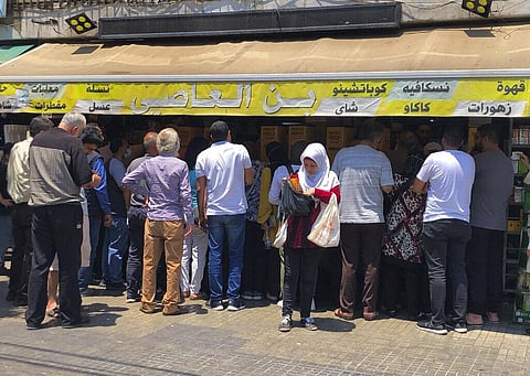 People stand in line outside a roastery in Beirut to buy coffee fearing there will be shortages after the price of beans increased, in Beirut, Lebanon, Wednesday, June 23, 2021. (Photo | AP)