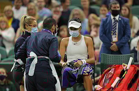 Britain's Emma Raducanu receives medical attention during the women's singles fourth round match against Australia's Ajla Tomljanovic on day seven of the Wimbledon. (Photo | AP)