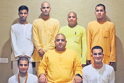 The seven monks who starred in Monks On Mission with Padasevan Bhakta Das (standing, second from left) and HG Rambhadra Das (seated, in centre);