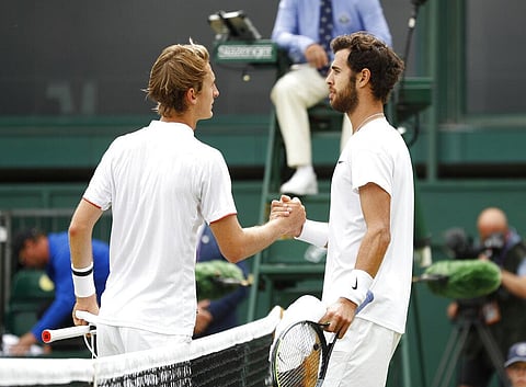 Russia's Karen Khachanov shakes hands with Sebastian Korda of the US, left, after winning the men's singles fourth round match on day seven of the Wimbledon Tennis Championships. (Photo | AP)