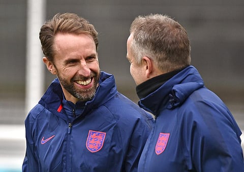 England's manager Gareth Southgate, left, and his assistant Steve Holland arrive for a training session at St George's Park, Burton upon Trent. (Photo | AP)