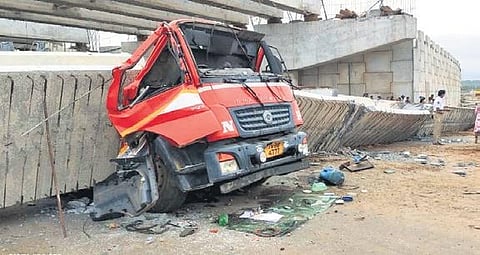A truck crushed by the collapsed beam at Anakapalli bypass. (Photo | Express)
