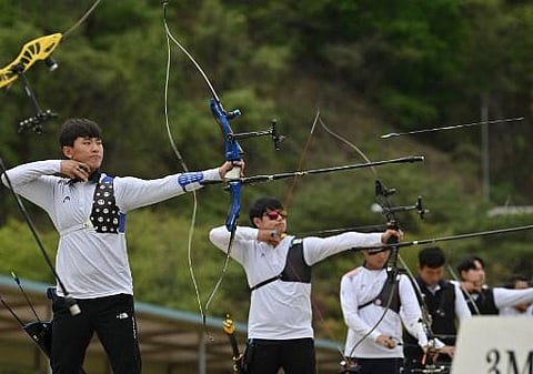 South Korean archer Kim Je-deok (L) competing during the final round of the national archery team trials for the Tokyo 2020 Olympic Games. (Photo | AFP)