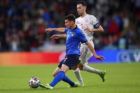 Italy's Matteo Pessina gets the ball past Spain's Sergio Busquets during the Euro 2020 soccer semifinal match between Italy and Spain at Wembley stadium. (Photo | AP)