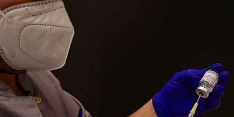 A health worker prepares a Moderna vaccine against coronavirus in Pamplona, northern Spain. (Photo | AP)
