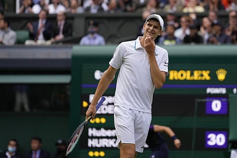 Poland's Hubert Hurkacz reacts during the men's singles quarterfinals match against Switzerland's Roger Federer on day nine of the Wimbledon Tennis Championships (Photo | AP)