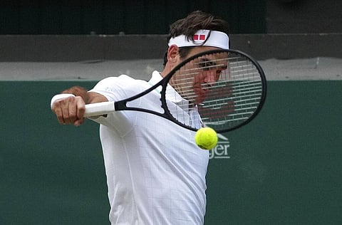 Switzerland's Roger Federer plays a return to Poland's Hubert Hurkacz during the men's singles quarterfinals match on day nine of the Wimbledon Tennis Championships. (Photo | AP)