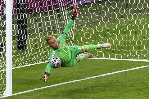 Denmark's goalkeeper Kasper Schmeichel dives to save a shot from England's Harry Maguire during the Euro 2020 soccer championship semifinal. (Photo | AP)