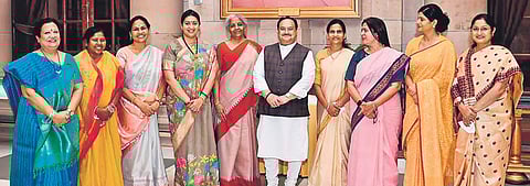 BJP president JP Nadda (C) with women ministers of the Modi government.
